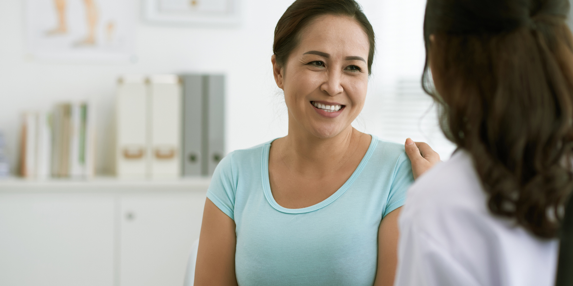 Woman smiling at her doctor