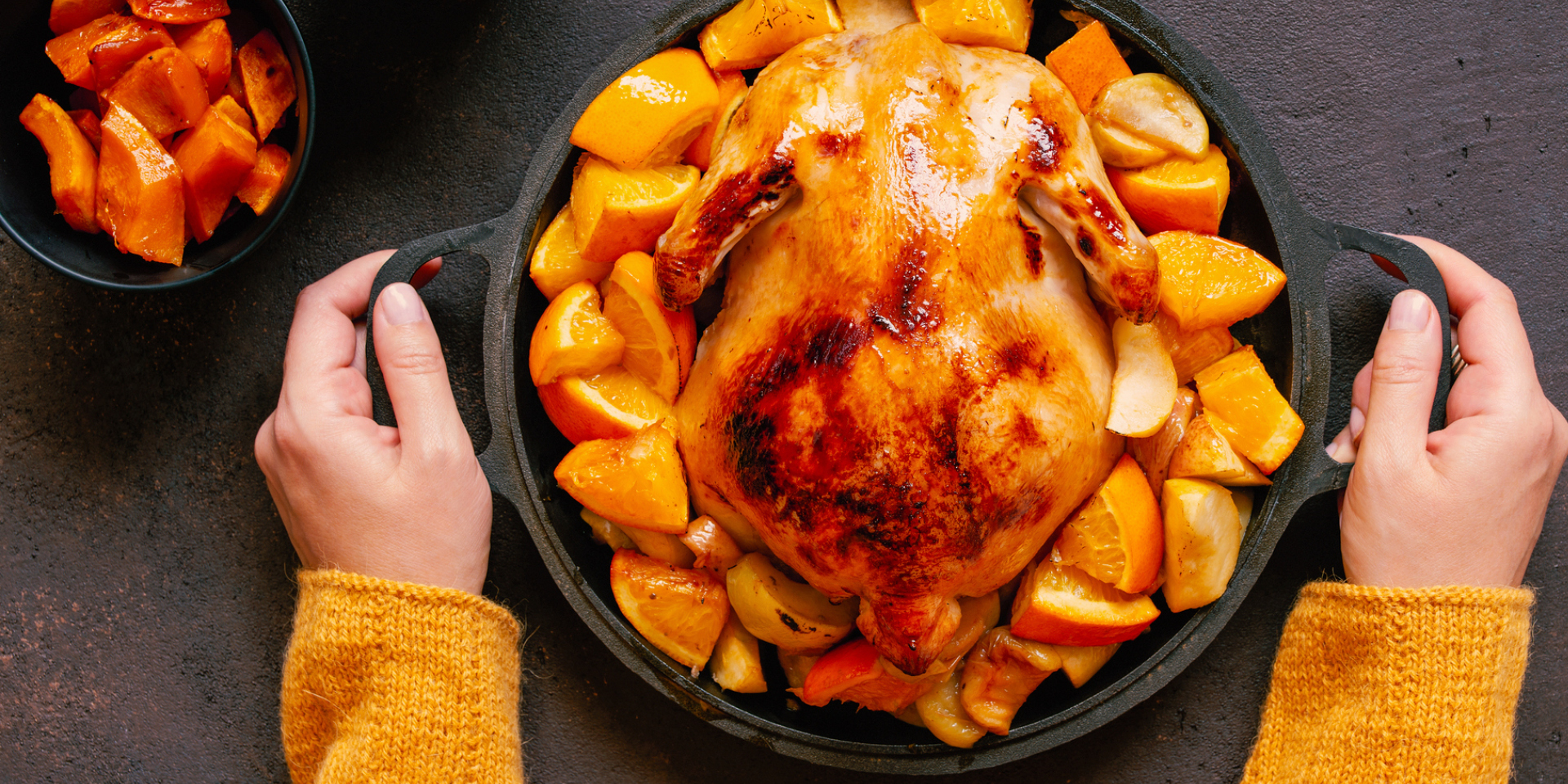 platter of whole turkey with sweet potatoes