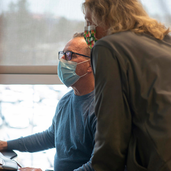 A man and a woman looking at a computer screen | Doylestown Health