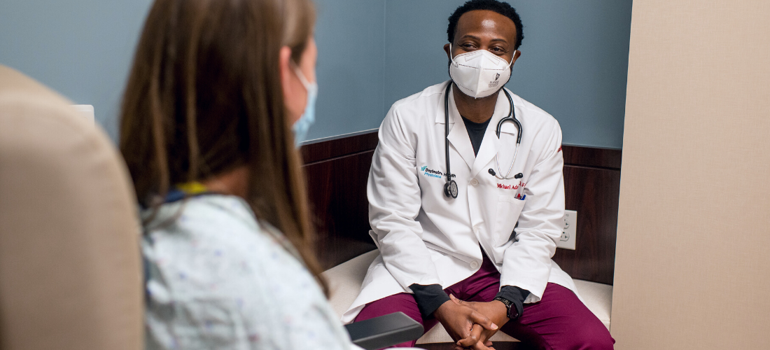 Physician discusses a health matter with a patient | Doylestown Health