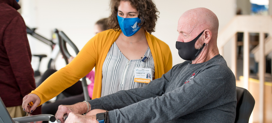 Rehabilitation provider discussing a treatment with a patient | Doylestown Health